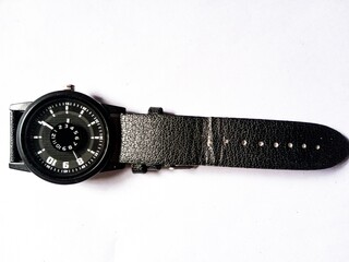 Black wristwatch on white background