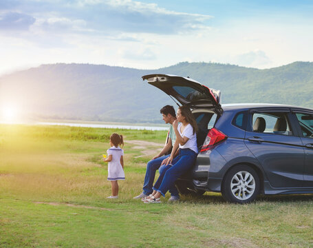 Asian Family.happy Little Girl With Family Sitting In The Car.Car Insurance Concept