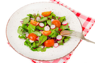 Healthy nutrition. light salad of beetroot leaves, radish and cherry tomatoes