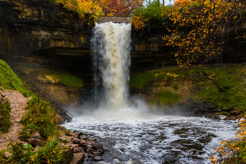 Fototapeta na wymiar The Waters of Minnehaha Creek Tumble over Minnehaha Falls, Minnehaha Regional Park, Minneapolis, Minnesota, USA