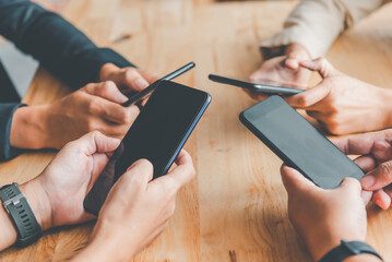 People group hands are playing mobile in groups to surf the social online world.