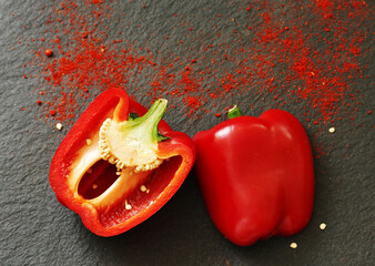 paprika on a black background slate. copy space
