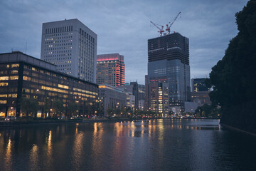 Buildings with lights over the river, city of Tokyo Japan.