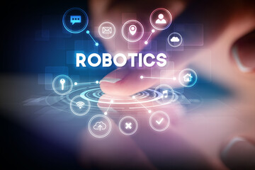 Finger touching tablet with web technology icons and ROBOTICS inscription, web technology concept