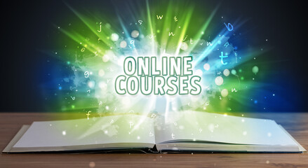 ONLINE COURSES inscription coming out from an open book, educational concept