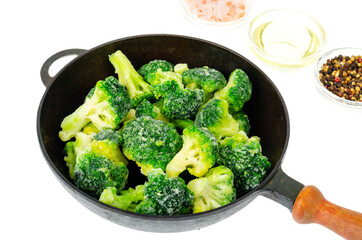 Frozen broccoli cabbage inflorescences in frying pan