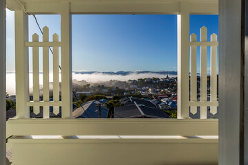 A view from the wooden terrace of a foggy day in Wellington, New Zealand