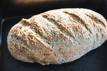 simple food ingredients, homemade sourdouhg bread on kitchen counter