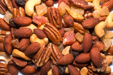 Nuts mix on a white background,Assorted nuts and raisin closeup on white backgrounds.