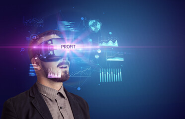 Businessman looking through Virtual Reality glasses with PROFIT inscription, new business concept
