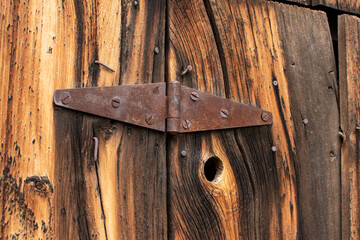 Antique hinge on an old homesteader's barn shed built on a ranch in Oregon.