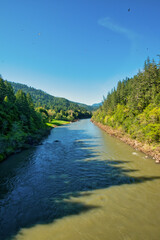Rogue River in Southern Oregon during a summer day. Vertical image.