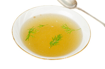 Plate with rich meat transparent broth with dill