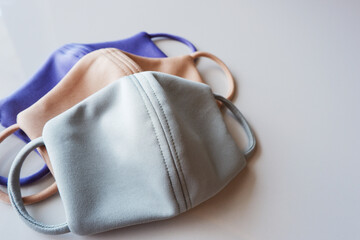 Three different colored face masks. Copy space.