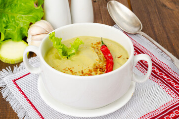 Spicy vegetarian vegetable puree soup green color, healthy eating.
