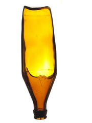 Old broken glass beer bottle of brown color isolated on a white background.