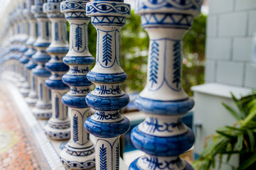 White pillars with blue stripes arranged on the bridge.
