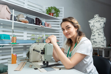 girl employee at the workplace in the sewing studio
