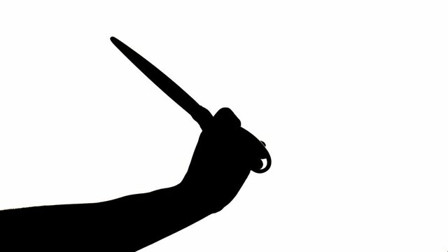 Silhouette of male hand with scissors on white background