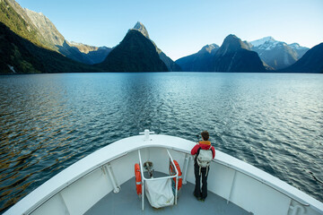 Traveller with beautiful scenic of milford sound in fiordland national park new zealand.