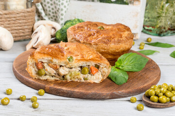 Baked pie with meat and green peas
