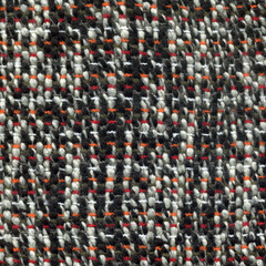 Handwoven wool fabric in black and white with red and orange details