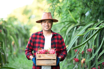 A picture of a smiling farmer holding a fruit box at a local Asian market.