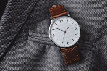 The men's watch is on the suit. Stock photography for business.