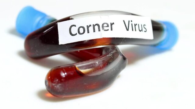 A turned test tubes with labels of corner virus lying on a white table. A Research of a fictional virus at laboratory.