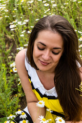 young girl in a field of daisies