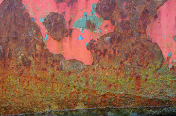 Texture of old rusty iron covered with peeling paint.