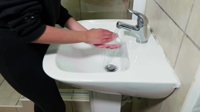 Mixed race girl washing hands against coronavirus