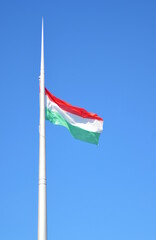view of the spire with the Hungarian tricolor flag flying