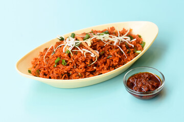 Schezwan fried rice with schezwan sauce, Chinese fried rice,garnished with spring onion and cabbage.indo chinese cuisine dishes.selective focus