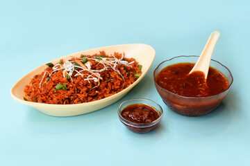 Schezwan fried rice with schezwan sauce, Chinese fried rice,garnished with spring onion and cabbage.indo chinese cuisine dishes.selective focus