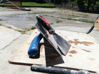 Craftsman plaster tools. Polished trowel,  putty scraper and trowel