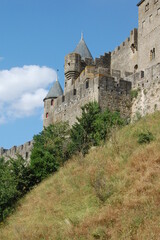 Fototapeta na wymiar Carcassonne castle, Provence, France, side view of the castle from the side of the hill in a sunny day in Provence. Middle age castle UNESCO.