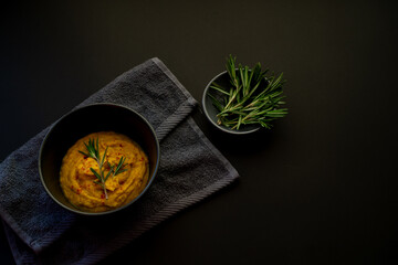 Fresh rosemary in a plate for spices and vegetable soup