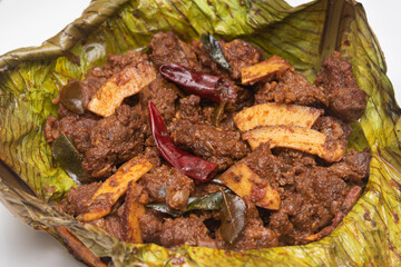 Beef fry curry roast mutton curry meat dish Kerala, India. Hot and spicy homemade side dish of Kappa biryani , Appam, Parotta, Puttu. South Indian non veg food