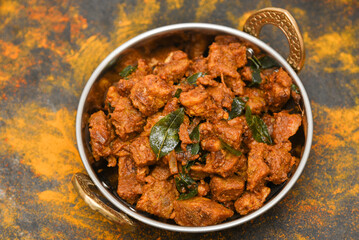 Beef fry curry roast mutton curry meat dish Kerala, India. Hot and spicy homemade side dish of Kappa biryani , Appam, Parotta, Puttu. South Indian non veg food