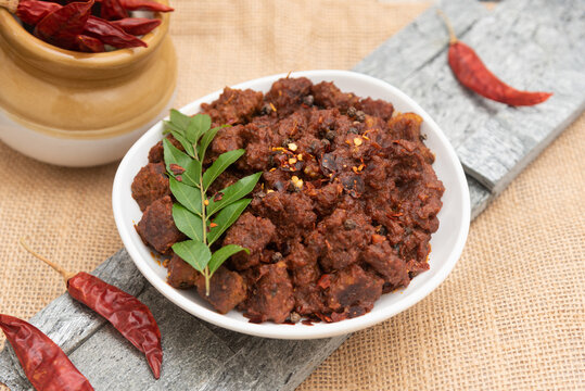 Beef fry curry roast mutton curry meat dish Kerala, India. Hot and spicy homemade side dish of Kappa biryani , Appam, Parotta, Puttu. South Indian non veg food