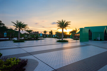 The tile floor in front of the leisure plaza at sunrise and sunset.