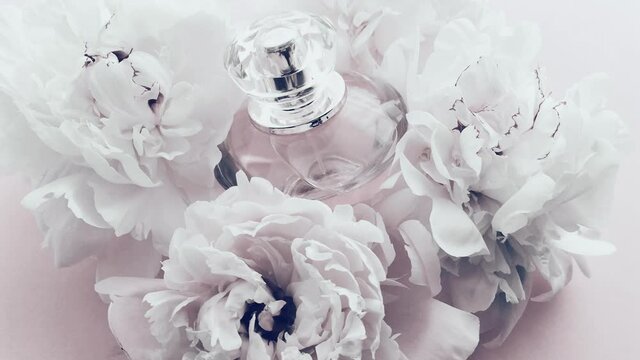 White perfume bottle with peony flowers, chic fragrance scent as luxury cosmetic, fashion and beauty product backgrounds