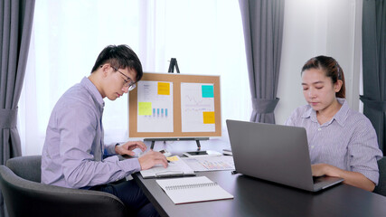 Administrator team Asian business man financial inspector and secretary making report, calculating balance. Internal Revenue Service checking document. Audit concept