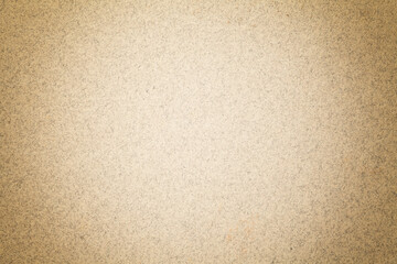 Texture of vintage light brown paper background with matte vignette. Structure of beige kraft cardboard with frame.