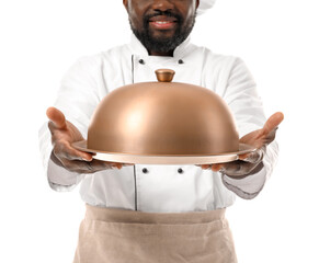 Male African-American chef with tray and cloche on white background