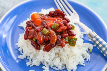Plate with tasty rice, beans and vegetables, closeup
