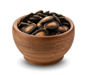 Watermelon seeds in wooden bowl isolated on white