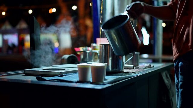 Acehnese barista manually pouring coffee in traditional method, also known as Kupi Sareng Aceh