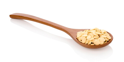 Crack shell watermelon seeds in wooden spoonon on white background.